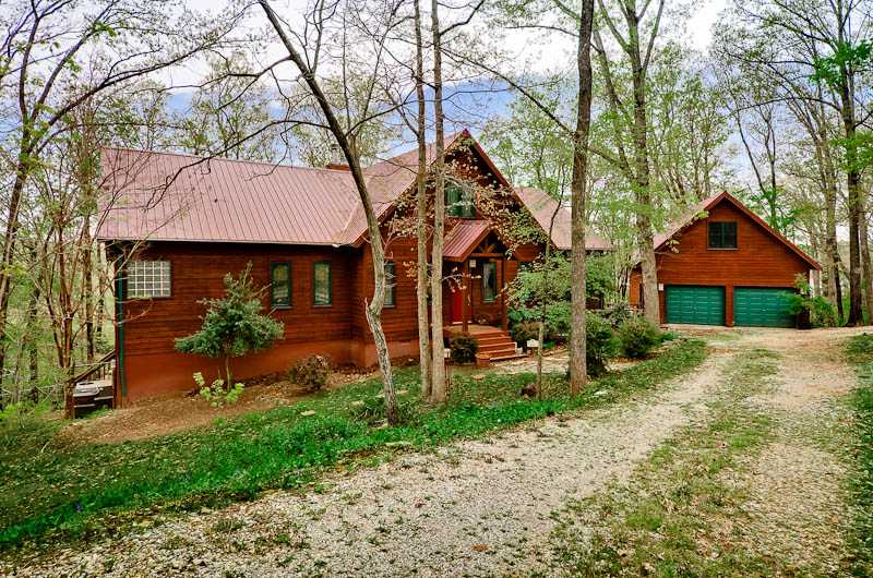 BEAUTIFUL 4269 SQ FT 3 LEVEL CEDAR CHALET BORDERED ON 2 SIDES BY WAR EAGLE & PARK OVERLOOKING WHITE RIVER, ARM OF BEAVER LAKE. LOCATED ADJACENT TO ENTRANCE TO WAR EAGLE PARK & MARINA. 2 MASTER BEDROOMS,2 MASTER BATHS, 2 WOOD BURNING FIREPLACES, 2 LAKEVIEW COVERED PORCHES, BONUS/EXERCISE ROOM WITH WET BAR FOR COOLING DOWN AFTER WORKOUTS! 500+ SQ FT HEATED & COOLED ARTISAN STUDIO/WORKSHOP ABOVE GARAGE.