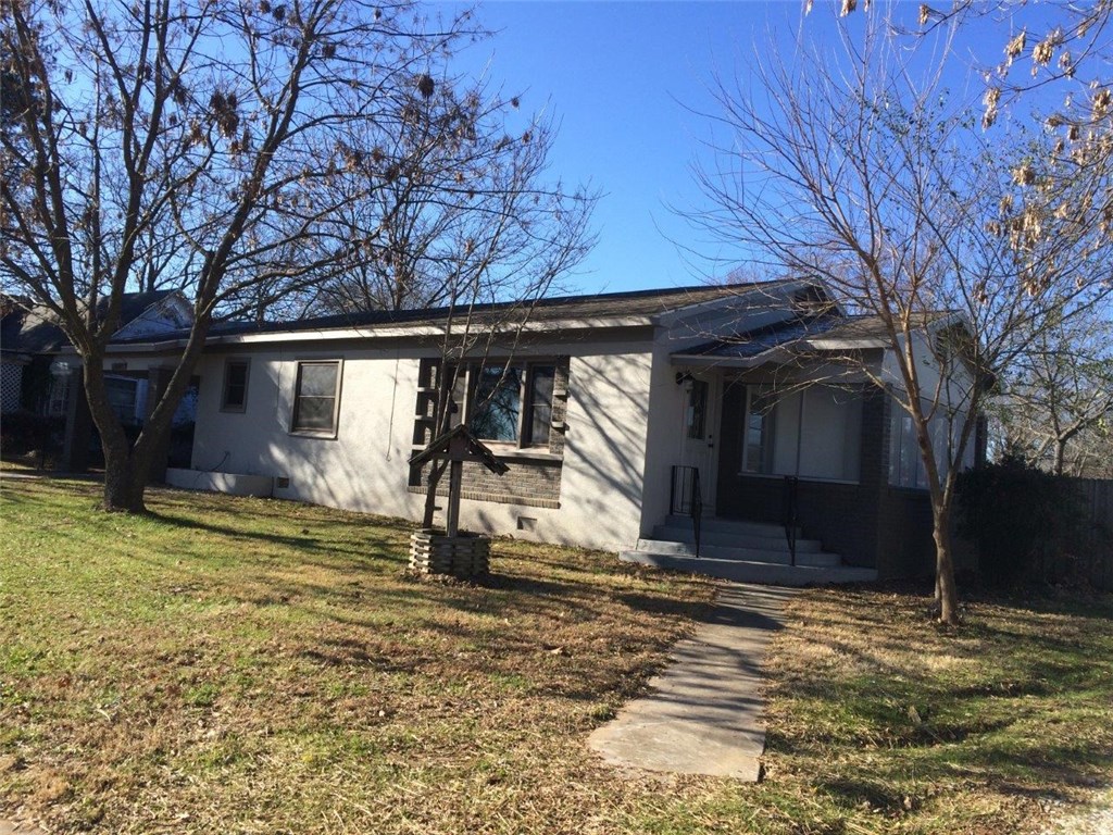 Mid century style real stucco house with screen room, 2 bedroom 1 bath, 2 car detached garage. Downtown Pear Ridge 1230 SF. Owner tried to keep the home original with refinished pine floors.