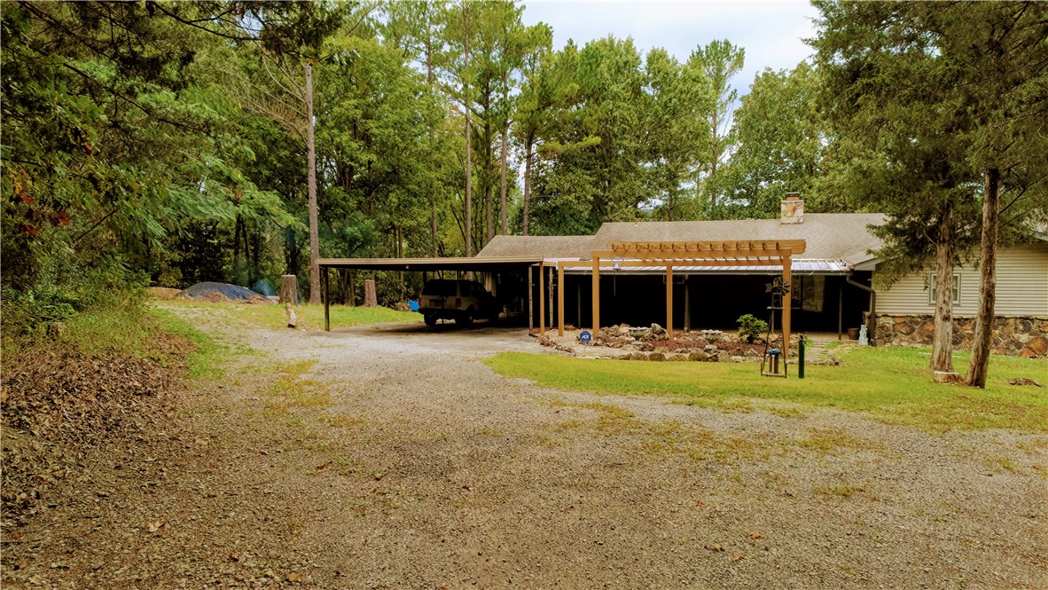 Country Home located close to Table Rock Lake with a Lake view. 3 bedroom 2 bath 2008 sq. foot home with attached 2 car garage.  Large living room with wood burning fireplace. Relax and Enjoy the view from the Large deck in the back of the house. Cellar located under the back porch.  Extra 1 car detached garage and shop building. Lots of mature trees on the 7.38 acres. Very private with no homes near. More pictures to come.