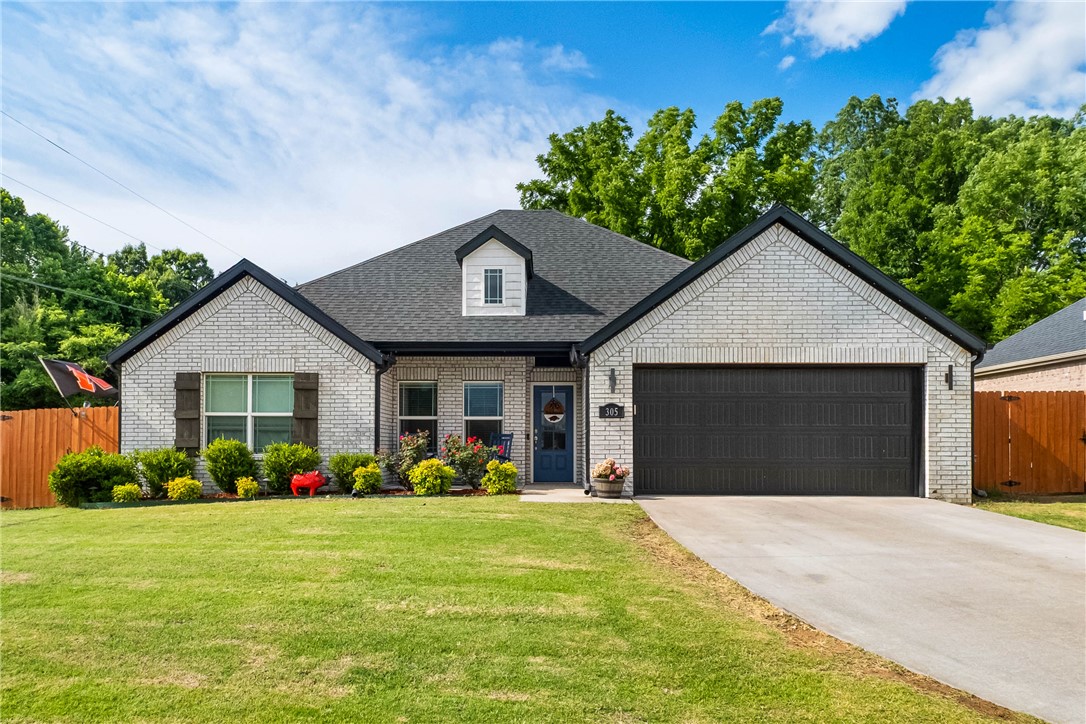 Built in 2021, this immaculate, traditional-style brick home sits on a prime corner lot, offering extra space, privacy, and fantastic curb appeal. Equipped with stunning granite countertops, a spacious pantry, a gas range, an extra large island and premium cabinetry, the kitchen is the ultimate gathering place. It has a thoughtfully designed layout perfect for anyone looking for a seamless blend of style and function. Don't let this one slip by, come see it today!