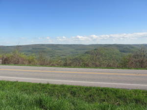 Spectacular Million $$$ View comes with this 2.65 acres !! also includes paved highway frontage, public water and electric available. Land lays on both sides of Hwy 7 with most on the north side which is the hill top and lays near level. Some open land, some with trees. Public water line crosses this tract on the north side of Hwy 7 along the Hwy frontage. See survey plat in Documents tab, this land is shown as Tract III which is divided into east half or west half, each with 2.65 acres, this tract is the west half, seller will provide a new survey at closing.