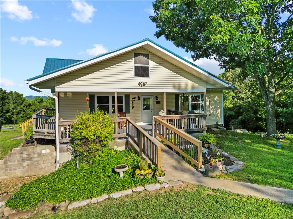 Private rural home only 25 minutes from Harrison, on 23 beautiful acres with paved road access and close to the Buffalo River and National Forest! Enjoy the view from this 2 or 3 bedroom, 3 bath home with a full, semi-finished basement, with lots of wildlife in your own back yard. Large 30x50 workshop/storage building with dirt floor gives you lots of room for your toys or projects. This home has had many updates recently and is waiting for new owners and has so many possibilities!