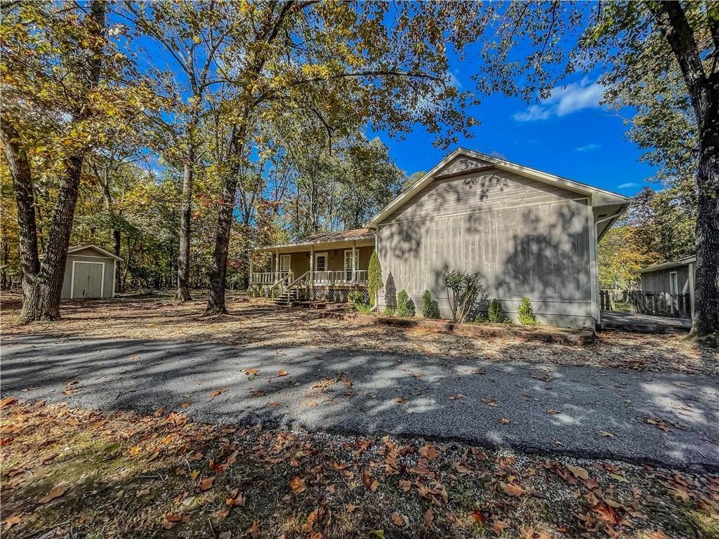 Spacious 4-bedroom, 3-bath home situated on a beautiful 1.62-acre corner lot in a quiet, established neighborhood! This well-designed home features a split-bedroom floor plan, two inviting living areas, gorgeous wood floors, and an attached 2-car garage. Need extra space? You'll love the detached 2-car garage/shop with electricity—perfect for hobbies, storage, or a workshop. With plenty of room both inside and out, this property offers comfort, versatility, and privacy. Don't miss your opportunity to make it yours—schedule your private showing today!