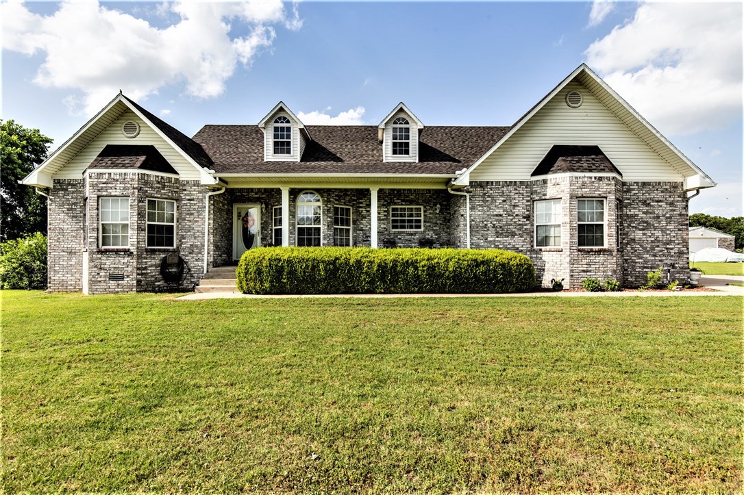 NEW STAINLESS Dishwasher/Microwave/Electric Range. Kitchen also has connect for gas range. All-brick home, 5.25 acres (level), 24x60 heated shop. Nice back deck/front porch, relax & appreciate quiet rural countryside. Large living room plus other room w/French doors & lots of windows could be 2nd living area, office, sunroom (central heat/air). Split bedrooms. Whirlpool tub, walk-in shower. HVAC 4 yrs. Roof inspected;good condition. Security system house & shop. Public water. Natural gas. 2 water heaters.