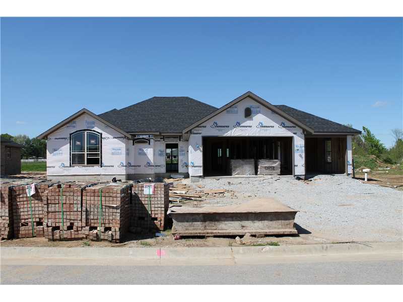 LOADED Home with all of the extras such as,Wood Floors,tile showers,custom cabinets,blinds,3cm granite,refrigerator,privacy fence,covered patio,fireplace,whirlpool tub,crown molding,wood beams,3 car garage,full sodded lawn