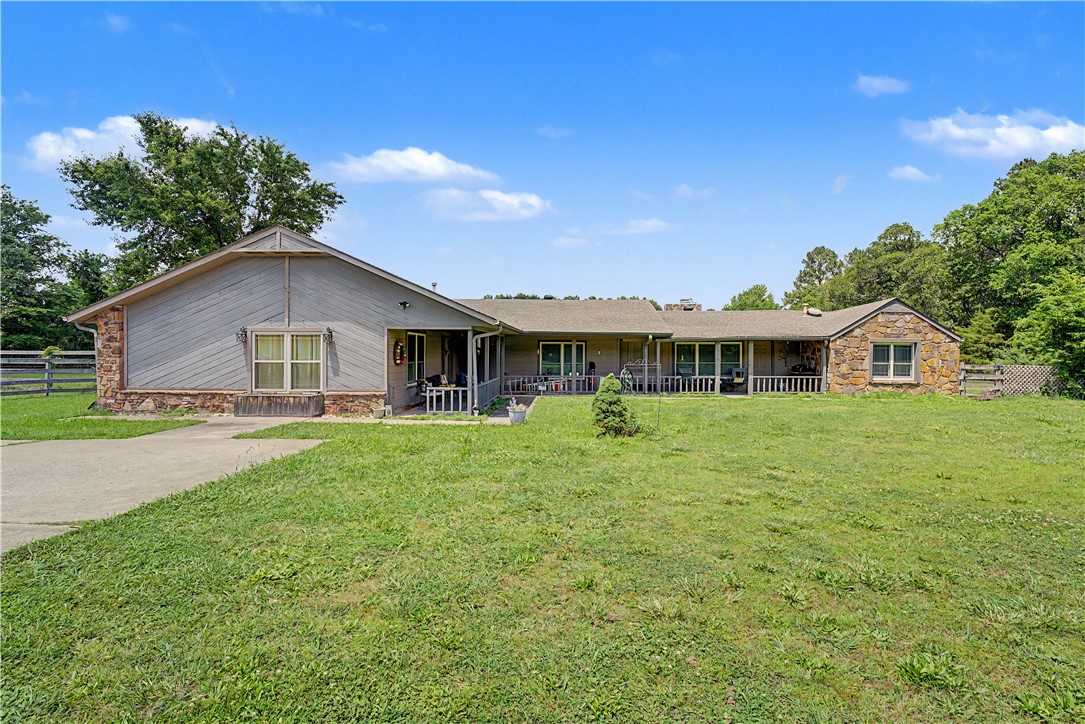 Nestled on 3.5 private acres in west Fayetteville, this spacious 2,700 SF, 3-bedroom, 2-bathroom residence offers a rare combination of space and convenience that is nearly impossible to find at this location. The thoughtfully designed floor plan features two distinct living areas, a full kitchen, and an expansive deck perfect for entertaining or enjoying the natural surroundings. Situated along the Wedington Drive corridor, the property sits just minutes from Interstate 49, the University of Arkansas campus, and an abundance of retail, dining, and medical amenities. Opportunities to own acreage this close to the city's core are increasingly rare — don't miss your chance to make it yours. 2,700 SF residential home with 3 bedrooms and 2 bathrooms. Two living areas plus a full kitchen and expansive outdoor deck. Minutes to I-49, University of Arkansas, shopping, dining, and medical facilities. Rare acreage opportunity in one of Northwest Arkansas's fastest-growing and most sought-after markets. Remodeled 1989