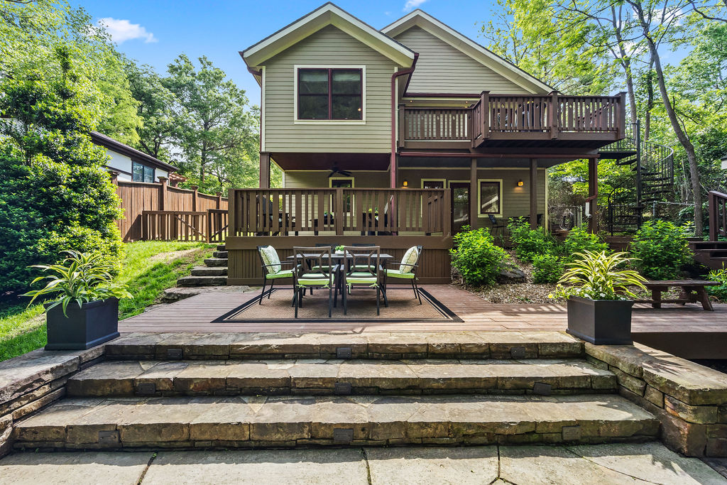 Welcome to your personal sanctuary in the heart of Fayetteville’s Wilson Park neighborhood! This spacious home and property offers room to spread out—perfect for entertaining, unwinding, and recharging. Fully renovated in 2008, with fresh interior paint and refinished hardwood floors in 2026, this home feels like new. The main level features airy open living areas and a private primary suite with a treehouse feel, flowing to a balcony overlooking the tree canopy and entertaining spaces below. Downstairs offers a flexible bonus room for second living, extra guests, and oversized laundry space that can serve many functions. We love the shed storage in place of a garage. Easy-access parallel on-street parking fits up to 4 vehicles, depending on length, plus ample guest parking 1 block away at Wilson Park. The large, fully fenced backyard offers multiple hangout spaces, including a stone patio and wood-fired pizza oven. Walk or bike to Fayetteville’s best destinations—yet feel worlds away at home.