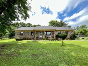 Looking for tranquility in your next country home? Take a look at this charming 3 bedroom, 3 full bath home with an extra living room or bonus room to enjoy. Experience the country life of maybe having your own small farm on the 9.98 acres. Home is also listed with total of 43.65 acres see flexmls#24-1027. If sold separately without all the acreage an easement will be in place for access to additional acreage.  Book your private showing today to see what could be yours. Agents see private remarks.