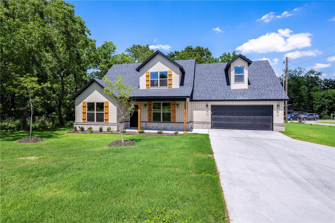 Corner Lot in a Fantastic location— easy access to I-49 & Highlands Golf Course. This 2 level NEW home is sure to please with Primary Suite on the main level featuring dual varieties, custom tile shower, free standing tub, & WIC. Open concept living area with engineered hardwood floors, abundant natural lighting, & gas log fireplace. Spacious Kitchen with stainless steel appliances (separate glass cooktop & wall mounted oven), sink has window to view of the FLAT backyard. Upstairs has 1 bedroom with WIC, Hollywood style full bath, & LARGE media room/hobby room. Covered Deck & pre-wired for a whole home Generator! Enjoy Nature, Golf courses, community pools, club houses, lakes, trails, & gun range (all are included within Bella Vista’s Community Amenities). 100% $0 down payment financing is available, ask for details. Targeted Completion Date: June 1st!