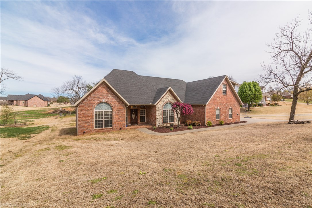 Exquisite home in Cave Springs on almost an acre. Come take a look at all the features this home has to offer. Features like 3 car garage with epoxy floor, surround sound setup inside and outside, 800 sqft bonus room or 4th bedroom, granite counters with a bar in kitchen, formal dining room, master with walk-in closet, dual sinks, walk-in shower with travertine tile and jetted tub. Clubhouse, pool and park in neighborhood. Minutes from Creek golf course. You'll love this amazing home!