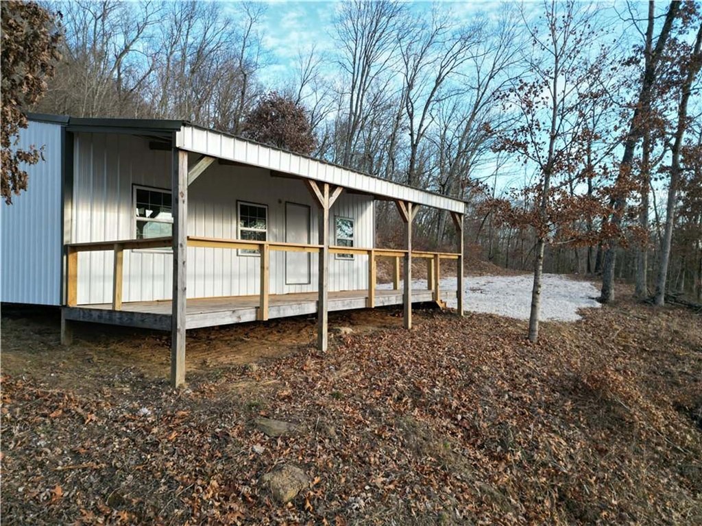 Owner Financing Available. Great short term rental opportunity in the Ozark Mountains of Newton County, Arkansas awaits! Newly built cabin with 1.73+/- stunning acres and an amazing view. Cabin has 300 sq feet of covered porches which is perfect for relaxing, entertaining, and watching unforgettable sunsets that look over the Little Buffalo Valley and distant mountain peaks. Outdoor enthusiasts will appreciate the endless opportunities nearby, including rock climbing, biking, hiking, kayaking, and exploring the Buffalo National River. The property is also conveniently located just minutes from Jasper, offering restaurants, shops, and the inviting charm of small-town Arkansas. Whether you're seeking a short-term rental investment, a mountain retreat, or both, this property captures the very best of Ozark living and adventure.