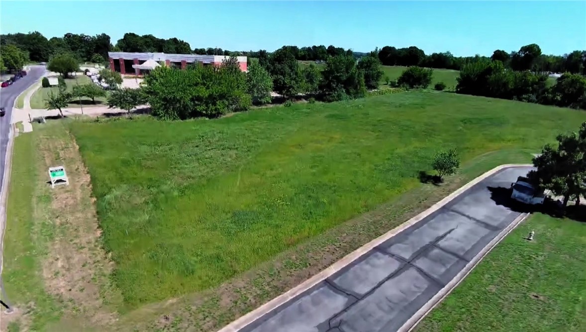 Prime vacant land surrounded by land owned by JB Hunt transport. Newly finished Dixieland Road extension that allows for another north/south corridor parallel to I-49. Adjacent to Mercy Pediatric Clinic, this could be a perfect location for another medical or medical office.