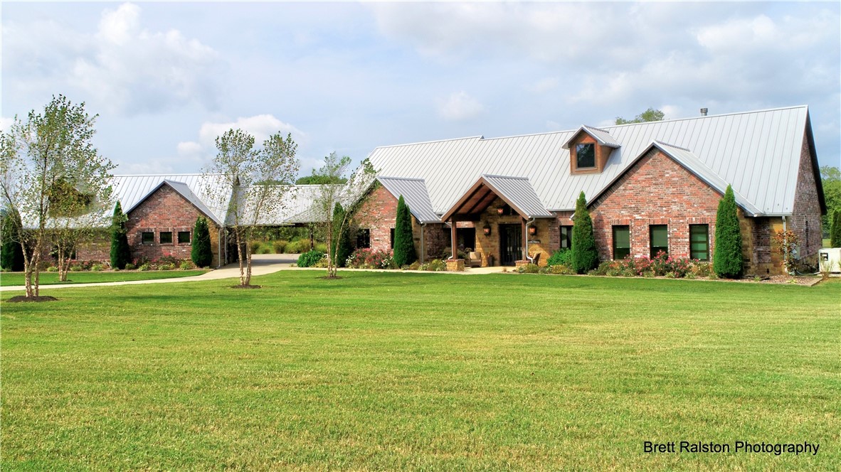 Incredible 20 Acre III Waters Custom Estate available in Bentonville!! Stunning 5720 Sq. ft. Rocky Mountain style home w/high quality construction throughout. This one level home was designed w/ every detail in mind. 3 bedrooms, 2.5 baths, gorgeous oak heated floors, 3 fireplaces, structural steel beams w/natural rust finish, Huge pantry, wine cellar, large screen porches & the most peaceful views of the 1 acre spring fed pond w/fountain. Huge master closet doubles as storm shelter. High end appliances including steam & convection ovens. Whole house water filtration system. Top of the line 3 car heated/cooled garage w/polished floors, vehicle lift, air compressor, central vac & double layer frosted glass doors. Beautiful barn includes ~800 sq, ft. of finished space, also heated/cooled.  Zip system metal roof, RV parking on site, whole house generator & control 4 smart system. Beautiful property also includes spring fed swimming hole AND Little Osage Creek running through the backyard. This is truly one of a kind.