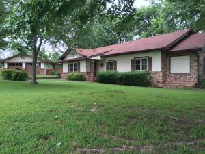 Enjoy your evenings relaxing on your back deck.  This home sits on 3 acres, fenced with a small barn and a perfect garden spot.  This home features 2 bedrooms 1.5 baths, 2 living areas, eat in kitchen, office/hobby room.