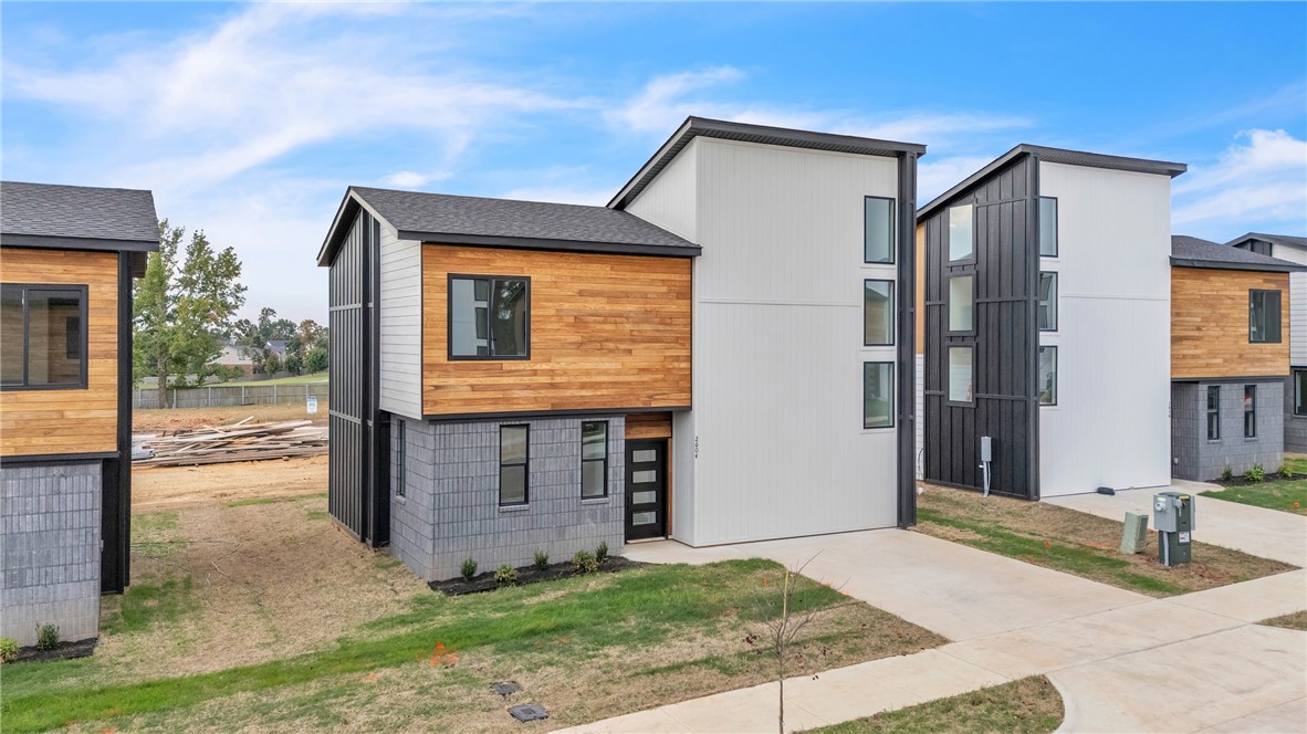 Photos are similar plan, different colors. Seller offering $5,000 credit toward closing costs! Preferred lender offers a 1% credit on the loan amount, applicable toward closing costs, down payment, or other eligible expenses. Our newest plan includes 3 bedrooms, 2.5 bathrooms & 1 Car Garage! Enjoy an upscale, low-maintenance lifestyle just over a mile from Pinnacle Hills Promenade and only 2 miles from the Walmart AMP. Residents enjoy top-tier amenities including a saltwater pool, a clubhouse with a kitchen & gym, pickleball court, playground, and bike paths. Live carefree with all lawn care and landscaping managed by the HOA, so you can spend more time enjoying your home and community. Each home features custom architectural design and high-end finishes, including Quartz countertops, cabinets with soft-close hardware, and a curated palette of White & Gold or Black and White for a bold, modern look. Each home is equipped with modern interior fire sprinkler system, providing enhanced safety. Buyer to verify taxes.