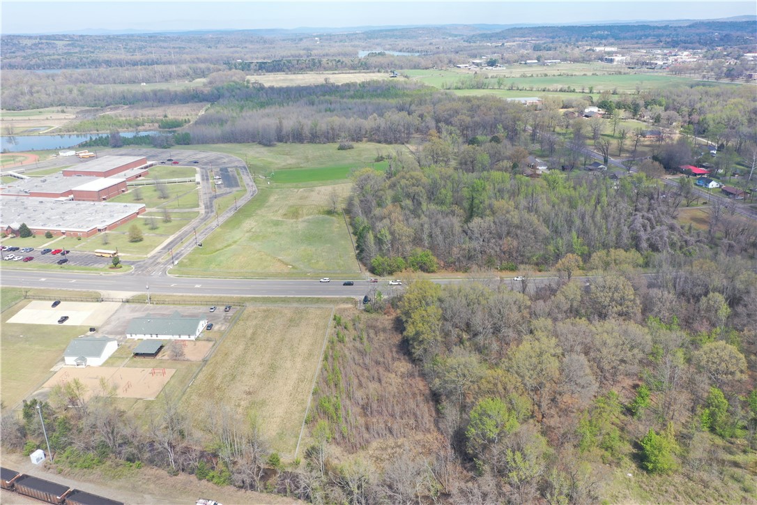 Prime commercial lot strategically located offering high visibility and excellent accessibility. Situated on a high-traffic road, this property benefits from substantial daily exposure, making it an ideal spot for businesses seeking to attract attention. Directly across from Russellville Junior High, this lot enjoys proximity to both educational and recreational hubs, including the Bona Dea Trails. With the vibrant downtown entertainment district just minutes away, this location provides a perfect blend of commercial potential and community connectivity. Perfect for retail, hospitality, or other commercial ventures, this lot presents a unique opportunity to capitalize on a high-demand, high-traffic area with substantial future growth potential.