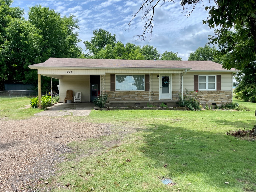 Come take a look at this charming 3 bedroom, 2 bath Russellville Home that's under $200k. Minutes away from it all & directly across the street from the Russellville High School is where you'll find yourself calling this place home. Plenty of yard space to enjoy or maybe relax in the enclosed porch/sunroom. Recent updates inside including some new flooring & kitchen cabinets. You'll also find plenty of space in the workshop for hobbies or make it into your own gym, the possibilities are endless with it. Call today to schedule your private showing.