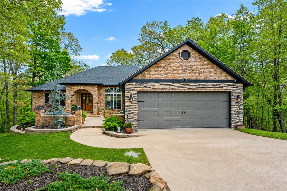 Fully renovated and truly one-of-a-kind, this immaculate home showcases upscale features that are rarely found together. The fully remodeled kitchen flows seamlessly into the living and dining areas, creating a bright, open layout that balances modern design with everyday functionality. The split floor plan offers 3 bdrms upstairs for comfort and privacy, while the lower level lives like a separate suite. With a massive 4th bdrm/flex space, 2nd living area + game room with a designer glass garage door that opens directly to its own entrance, private deck, & bike wash station, this space is ideal for guests, multi-generational living, or income potential. 
Homes that combine this level of finish, flexibility, and location are few and far between. With direct trail access and minutes from Blowing Springs Park, the new Oz Trails Bike Park, and Bella Vista’s renowned lakes, streams, and golf courses, this property delivers a lifestyle that’s as unique as the home itself. List of improvements attached. 3 bedroom septic