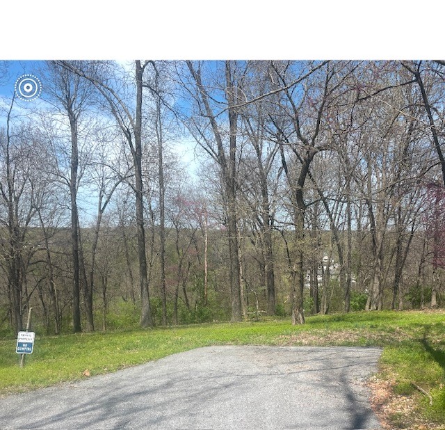 Beautiful 2.04 acres at the end of the cul-de-sac at Springdale Country Club. If you are a golfer, this is a great location for you. Plus it's very close to NWA Mall and restaurants. This is an excellent location for your dream home. Property has several large trees!!