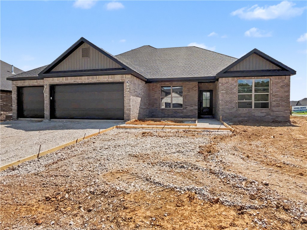 Experience the Marvin plan at Spring Creek Farms. This modern community will feature a community pool, playground and walking trails. The Marvin Plan offers refined single-level living with a thoughtfully designed 4-bedroom, 2 bath layout that blends comfort and sophistication. The open-concept design is enhanced by soaring vaulted ceilings accented with beams, and electric fireplace. The kitchen is beautifully appointed with custom soft-close cabinetry extending to the ceiling, a gas range, fully vented hood, and built-in microwave—perfectly balancing style and functionality. The primary suite is a serene private retreat, featuring a a tray ceiling in the bedroom and a luxurious walk-in shower for a true spa-like escape. A 3-car garage and a large covered patio with gas and ethernet hookups complete this thoughtfully crafted luxury design