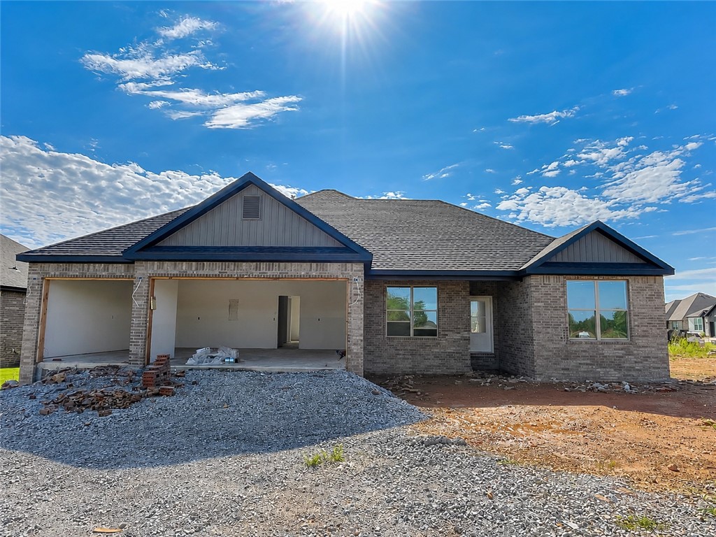 Experience the Marvin plan at Spring Creek Farms. This modern community will feature a community pool, playground and walking trails. The Marvin Plan offers refined single-level living with a thoughtfully designed 4-bedroom, 2 bath layout that blends comfort and sophistication. The open-concept design is enhanced by soaring vaulted ceilings accented with beams, and electric fireplace. The kitchen is beautifully appointed with custom soft-close cabinetry extending to the ceiling, a gas range, fully vented hood, and built-in microwave—perfectly balancing style and functionality. The primary suite is a serene private retreat, featuring a a tray ceiling in the bedroom and a luxurious walk-in shower for a true spa-like escape. A 3-car garage and a large covered patio with gas and ethernet hookups complete this thoughtfully crafted luxury design