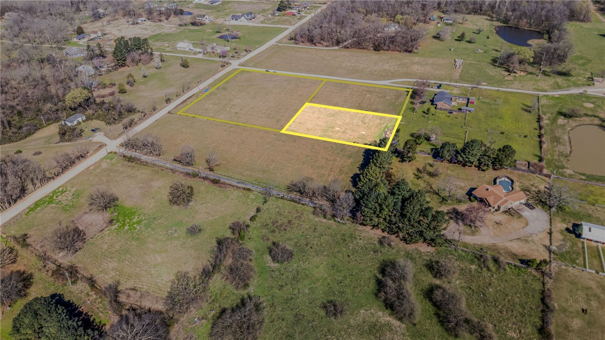 Build your next home on this approximately 1.16-acre flat parcel ideally located between Hwy 72 and Hwy 102. With a spacious layout and convenient access to nearby schools, shopping, and dining, this property offers the flexibility to create a custom home with room to enjoy the outdoors. Located less than two miles from Bentonville West High School and close to Gamble Elementary, Marrs Mercantile, Walmart Home Office, and the future Centerton Community Center, this is a great opportunity in a fast-growing area.