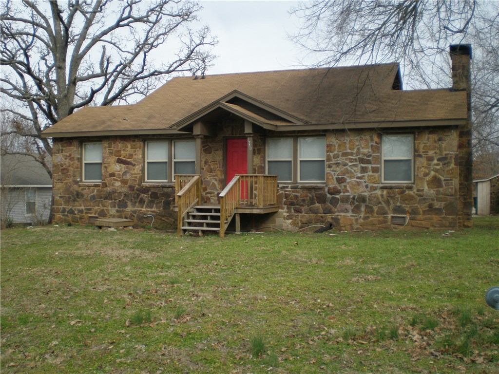Great investment property! This native stone home has 3 bedrooms, 2 baths, new AC, new vinyl windows, hardwood floors, a wood burning fireplace, an oversized lot, and tons of storage in the basement. This property is located on the U of A bus route, making this property perfectly suited for a local investor or student parent looking to put their rent money to work.