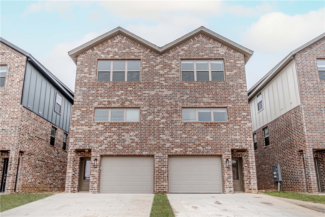 Walk in to an open living room that features a fireplace, riverside doors, and modern lighting fixtures. Kitchen has stainless steel appliances, beautiful white painted cabinets with white granite to give it that clean, modern look. The master bath has marbled walk in shower with double vanity. Backyard is fenced in with a patio slab!