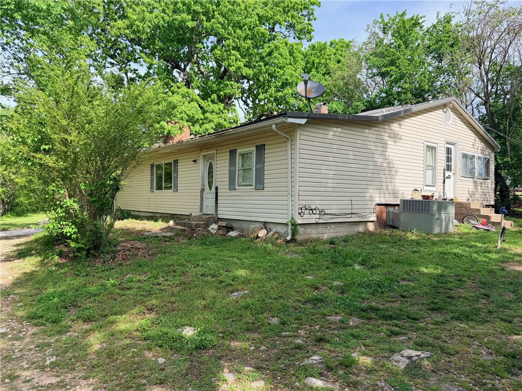 3 bedroom, 1 bath home in Bellefonte. (2nd bathroom needs repairs.) Lots of space inside with a wood fireplace, wood, tile and carpet flooring. Newer metal roof. Outbuilding has electric. Nice level and shaded yard. The wood stove in front of fireplace does not convey. Selling AS-IS. Property will not go VA, RD or FHA. All numbers approximate. NO OFFERS ACCEPTED UNTIL 5/26/26.
