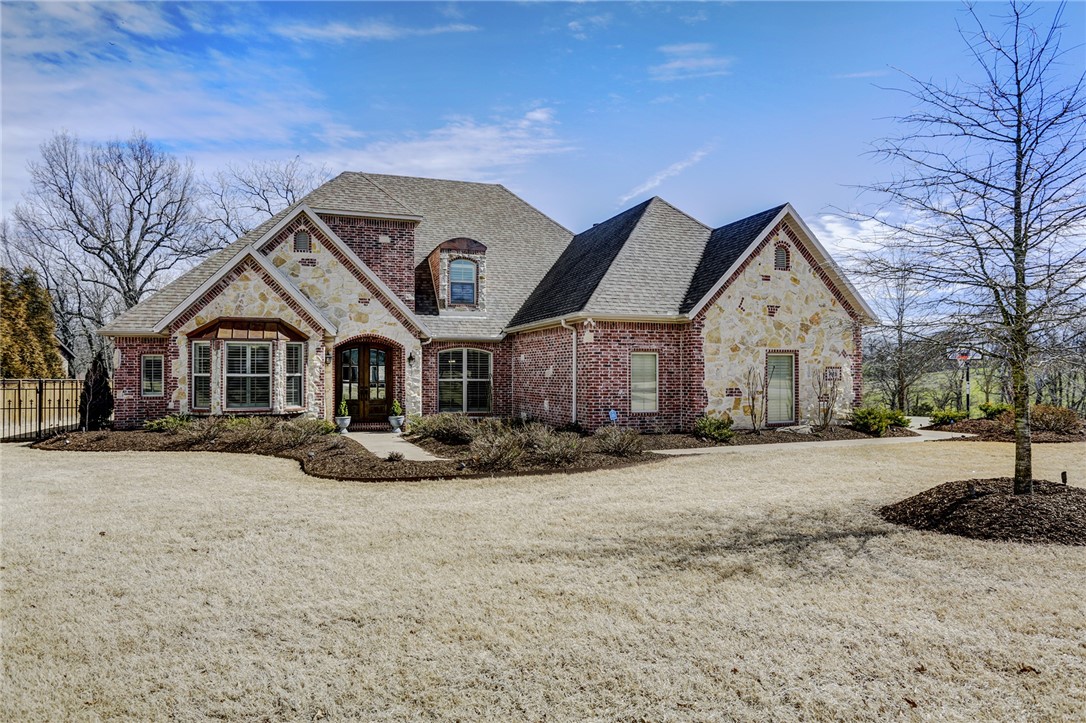 Beautiful custom home on 2 acres with amazing updates throughout.  It offers quality, convenience and serenity in a wonderful neighborhood that is walking distance to Sassafras Winery.  Located 10 minutes from Mission & Crossover. Amazing interior finishes with hardwood floors, granite, custom cabinets, tall ceilings and walk in closets. All new carpet upstairs. Backyard includes covered & uncovered stone patio and new gas fireplace, small iron fenced in area.  A covered garden and pirate ship playset do convey.