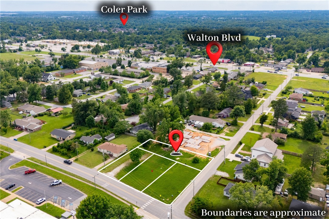 Downtown Bentonville opportunity! Four developable lots located just a short walk from downtown, across the street from Sugar Creek Elementary School and Thomas Jefferson Elementary School. Three lots are zoned DN2, offering flexibility for denser development, while the fourth is ideal for a single-family home. Conveniently located near mountain bike trails, schools, and downtown amenities—great potential for an end user or developer. Architectural plans included.