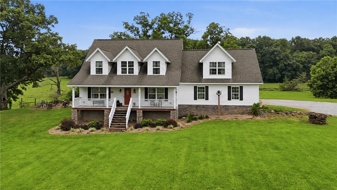 Multi-generational family farm with 2 houses, year-round creek and 77.56 acres! The primary farmhouse was built in 2015 and offers 4 bedrooms, 2 bathrooms, living room, family room, formal dining & 2 car garage. Enjoy the views and privacy from the covered front porch or the expansive back deck overlooking the creek and pastures. The guest house offers 3 bedrooms, bonus space upstairs, remodeled kitchen and bathroom, living room, dining room, very large cellar basement & a detached storage garage with an attached carport. Over 50 acres of fairly flat pastureland countryside. Large barn with office & workshop space included. Pole barn, dairy shed, large garden space & well house included. Just minutes from downtown Pea Ridge & Pea Ridge schools and 20 minutes from Downtown Bentonville & new Walmart Campus. Farm equipment negotiable with acceptable offer. Additional adjoining 5.48-acre lot is listed separately under MLS # 1354762. No sign on property. Shown by appointment only.