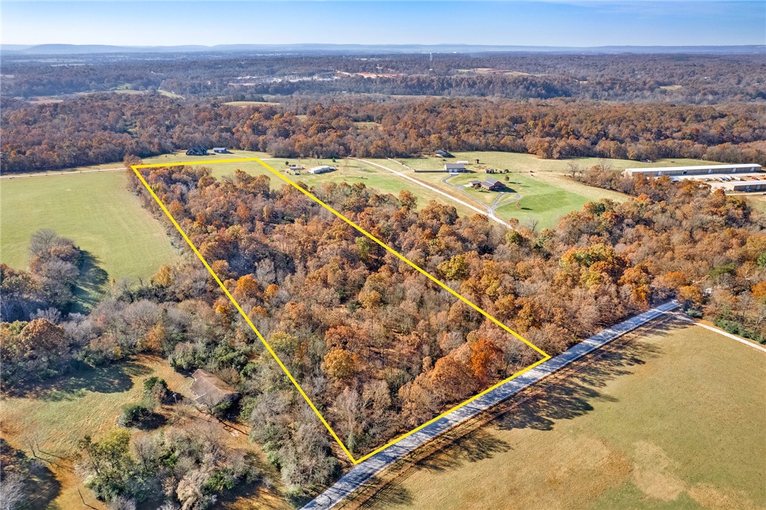 Located just west of Fayetteville on John Garrison Road, this 10.31± acre tract has recently been improved, making it an excellent opportunity for a custom homesite. The property is approximately 20 minutes from Fayetteville and is zoned for the Fayetteville School District, offering privacy with convenience.

The owners have invested significantly in the land, including dirt work that created a level, build-ready homesite near the back of the property. The upgraded, graveled access road now allows easy vehicle access to the homesite, with a newly installed culvert providing proper drainage and long-term durability.

Selective clearing along the front of the property removed underbrush while preserving mature hardwoods, creating an additional potential homesite. The tract features rolling terrain, mature timber, and over two acres of open pasture, offering multiple build options for a private estate.