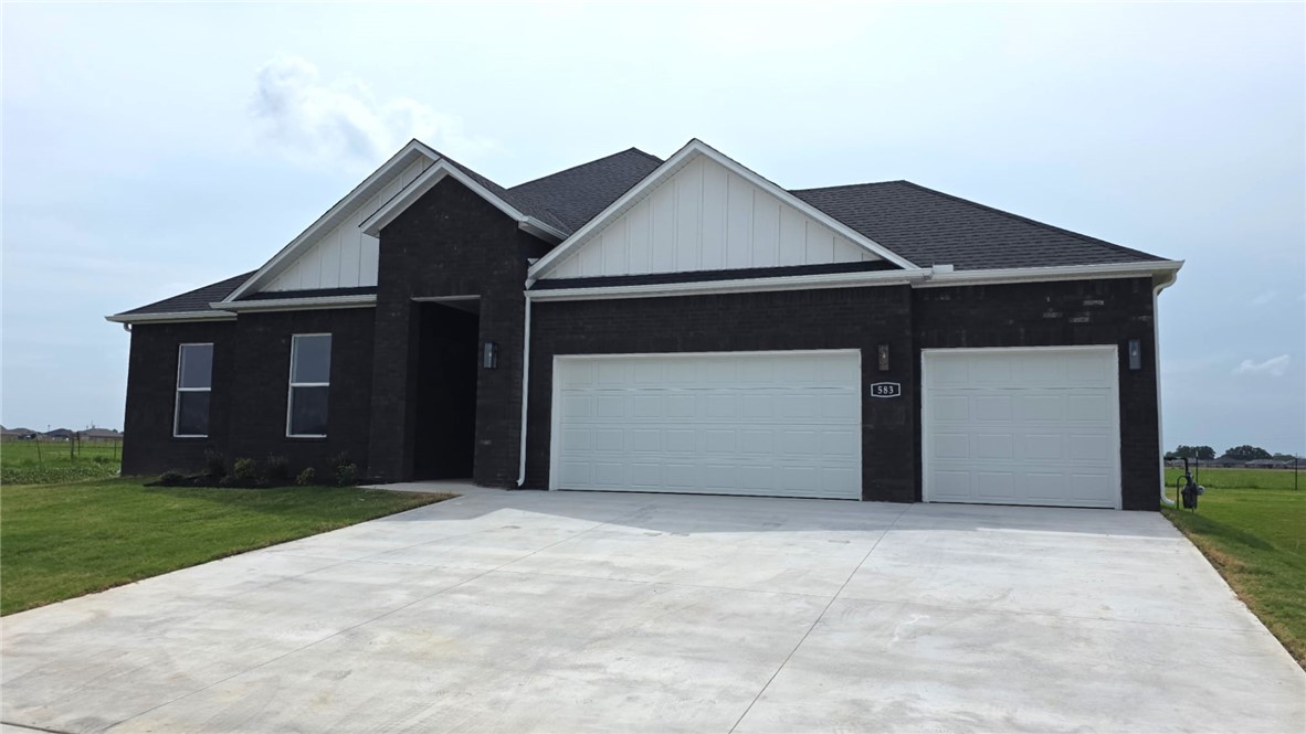 The Holden Floorplan in Renley Rae in Springdale, AR! This plan offers 4 bedrooms and 3 bathrooms with a separate office space! Single-story homes feature engineered wood flooring throughout and tile flooring in the primary bathroom. The kitchen features quartz countertops, 42’’ cabinets, black hardware, and a gas range. The living room features a beautiful modern fireplace with a poplar mantle! Fans are included in all bedrooms and the living room! The primary ensuite will have a walk-in shower, separate tub, and quartz countertops! The exterior of these homes will have 4-sides brick with siding (per plan) and a 3-car garage! Each home will have a lovely covered back patio. Taxes, HOA, and parcel TBD. Home is located within Tontitown city limits but has a Springdale address and zip code.