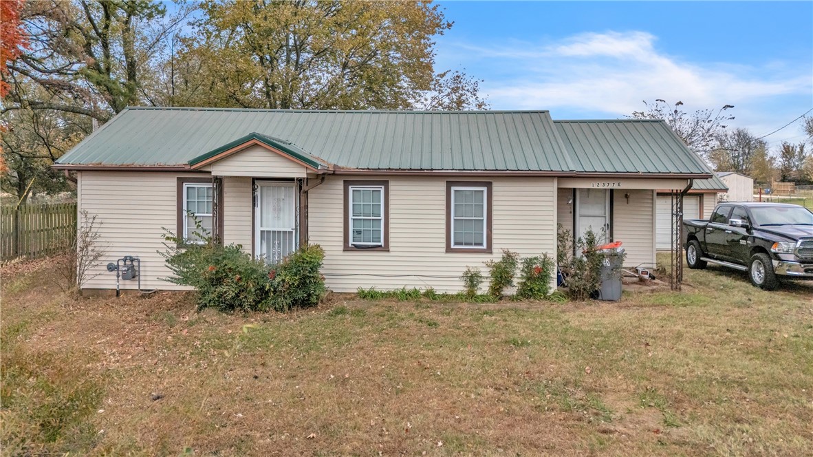 Explore the potential of this charming 2-bedroom, 1-bathroom home located on a spacious 1-acre L-shaped lot. This property combines comfort & versatility, making it an ideal canvas for creating your own private retreat. The 1-car garage offers additional storage space & the possibility of a workshop. For added safety, a dedicated storm cellar is included. The covered patio at the rear provides an excellent space for relaxation or entertaining throughout the year. With an acre of land, this property presents opportunities for hobby farming or various outdoor projects. It also features well water, previously utilized for gardening & livestock. This home is being sold AS-IS, providing a unique chance for buyers to personalize the property. Whether you are a first-time homebuyer, a DIY enthusiast, or someone seeking a rural lifestyle, this residence is ready for your vision. Recent updates include new apex plumbing & a new main water line in 2025. HVAC is older & duct work needs replaced.