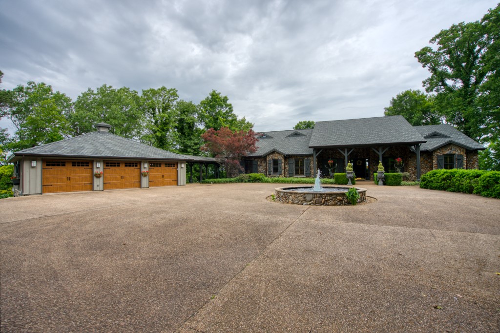 Truly a one of a kind Beaver Lake home! Property is located a half mile behind Beaver Dam, giving you an amazing view of the White River, Beaver Lake, and the back of the dam! No other privately owned location on this lake gets you so close to this rare view! Watch boats on the lake, fishermen on the river, view sunsets, and experience the sight AND sound of water coming through the dam floodgates and into the White River! Custom features including intricate custom cabinets, moldings, and ceilings, plantation shutters throughout, oversized doors and high ceilings, expansive outdoor entertainment area, sauna and laundry adjoining the master suite, hidden walk-in kitchen pantry, custom rock work on the entire exterior, 3 car garage with storage, and more (see attached feature sheet)! Half mile paved private drive and large gated entry way. Marina boat slip included! Adjoins the Corps of Engineers take-line so you can hike to lake or river on government land. Boat ramps on the river and lake less than 5 minutes away!