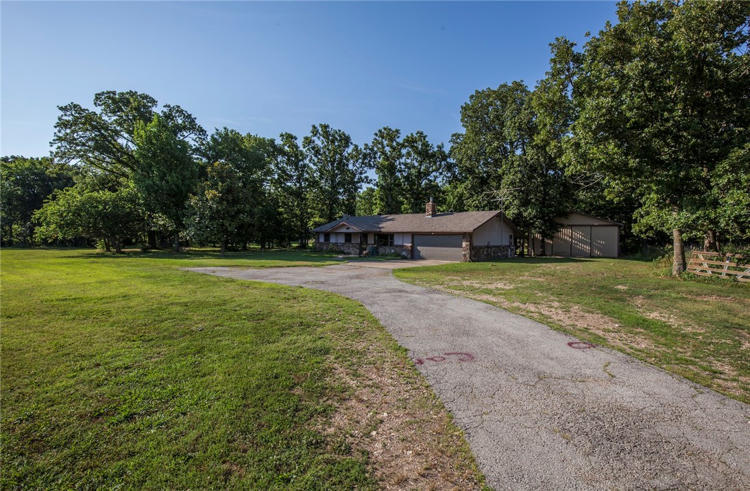 Country Living!!! 3 bedroom 2 bath home with acreage. Wood burning fireplace insert, large shop.