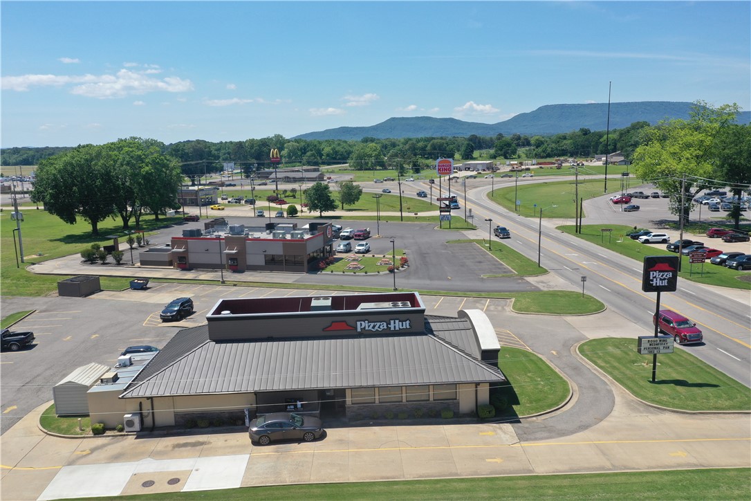 Prime commercial opportunity with high visibility Hwy 7 frontage and strong existing cash flow. This well positioned property is currently occupied by Pizza Hut with an active lease in place for several more years, offering immediate investment stability. Situated on over an acre, the site features ample parking, excellent accessibility, and outstanding exposure to daily traffic. Located just minutes from Mount Nebo, popular bike trails, and other area attractions, this property benefits from both local and tourist traffic. Ideal for investors seeking a proven location with long-term potential.