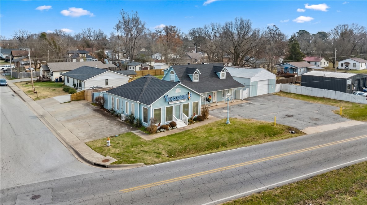 Welcome to a great investment opportunity located near beautiful downtown Springdale. The property offers unparalleled flexibility, easily configured as one large commercial hub or segmented into two to three independent units, including dedicated office space and a separate shop/warehouse. Located minutes from the energy of Downtown Springdale, capitalize on the dynamic C1 Neighborhood Commercial zoning by the City of Springdale, supporting a broad spectrum of move-in-ready uses. Significant capital expenditure is mitigated by major 2022 upgrades, including a new roof, gutters, and two replaced HVAC systems. This is a low-maintenance, high-potential investment that allows an owner-occupier to operate from one unit while leasing out the others for great revenue generation. This is a rare chance for strategic investors and owner-operators to acquire a highly flexible asset. Schedule your private appointment now!