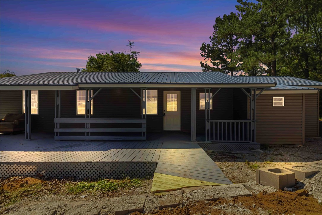 Fully remodeled 3-bedroom, 2-bath home on 1.8 acres in Huntsville! Enjoy the beauty of the Ozarks with a private pond, open space, and peaceful surroundings. Conveniently located on Business Hwy 412, this property offers the perfect blend of country living and accessibility. Just minutes from War Eagle Creek, outdoor recreation, and all the charm of Madison County. Within 45 mins of Fayetteville and Springdale. Seller offering $5,000 credit for buyer's closing costs and $3,000 preferred lender credit available.