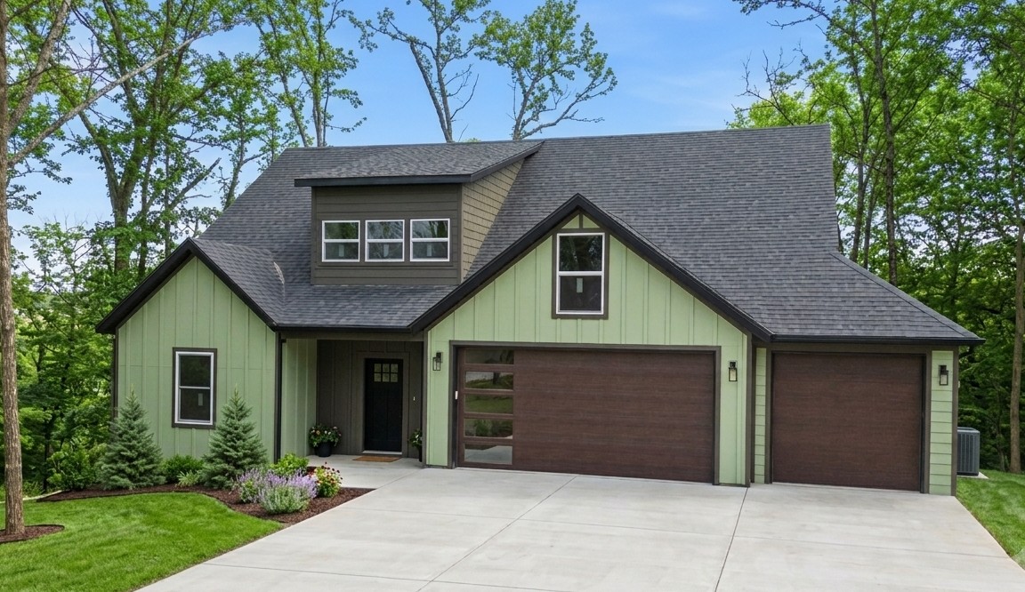 Bright, modern 2,215 sq ft home at Waterside Lane with Loch Lomond views. 3 bedrooms plus office, 2.5 baths, and insulated 3-car garage. Open living with vaulted ceilings and Pella windows that flood the home with natural light. Kitchen features quartz counters, Frigidaire Gallery appliances and pantry. Primary suite opens to the deck and offers a freestanding tub, large shower and generous walk-in closet. Full-length rear deck 45' x 12' with 30' x 6' covered section and dual access from living room and primary. Durable Hardie Board siding, Titan Class 3 roof, .34-acre lot. Preferred Lender Credit of 1% of loan amount up to a maximum of $3,000.