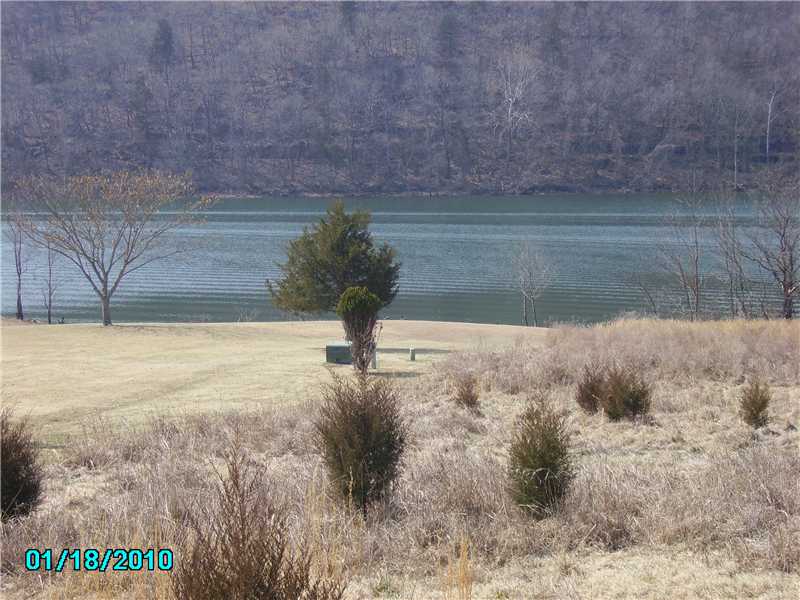 Gentle slope to the waters edge. Wide lakefront lot with all utilities there and under ground. One of the last available in Holiday Island. Priced for a quick sale!