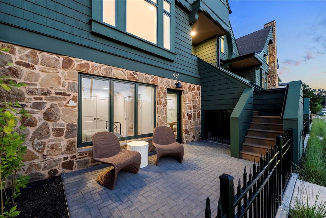 Welcome to Orchard Trailside Townhomes, Bentonville's most prestigious luxury townhome community, offering direct connection to the Downtown Trail and the Razorback Greenway. This thoughtfully designed residence features a 4bed, 3.5bath floorplan w/ a lively front patio & a private mother-in-law suite w/ its own entrance, full bath, & beverage station. Crafted w/ elevated finishes throughout, this Orchard Townhome showcases French oak engineered hardwoods, quartz countertops, custom white oak cabinetry, & cast stone fireplace. Upgrades include whole-house water filtration system, EV charging, gas range, & integrated Smart Home features such as ceiling speaker audio, Smart Lock entry, & Smart Thermostat. An oversized two-car garage completes the layout. Living at Orchard Trailside in Bentonville, AR means effortless access to the city's most desirable lifestyle amenities bike paths, parks, cafés, dining, arts venues, boutique shopping, the library, and downtown cultural experiences, all from your front door.