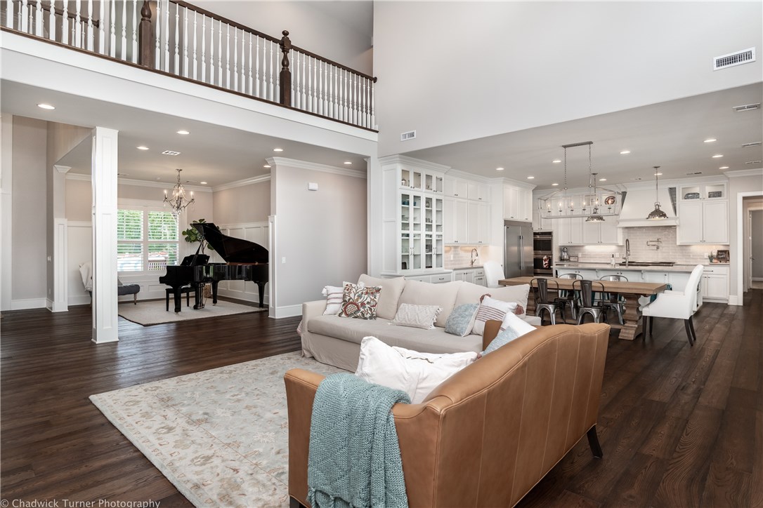 Elegant and Classic Custom-Built Home in Oak Tree!   Soaring ceilings and an open floor plan welcome you to this stunning home which has been perfectly designed with tremendous thought and detail throughout!   Built in 2018, Featuring over 6000 sfeet, 6 BRs/5.5 BAs, sitting on a 1.16 acre flat fenced park-like yard!   Gourmet kitchen with Wolfe Range, Double Dishwashers, Ice maker, Double Ovens.  Huge Master Suite on Main Floor, Main-level Media Room built for entertaining to flow out onto the covered patio.  Plantation Shutters throughout Home and Garage, Extensive Storage, 4 Car Garage with workshop area.