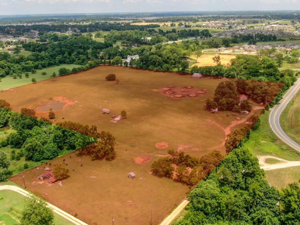 Developmental Potential! 29.36 Acres off W Monroe in Lowell. 482’ Hwy 264 road frontage. Cleared and level land with pond. Parcels include #12-02489-000,12-02010-604,12-02488-000, value in land and location. Easy access to XNA Airport and I-49. Fast growing area and an ideal investment opportunity!