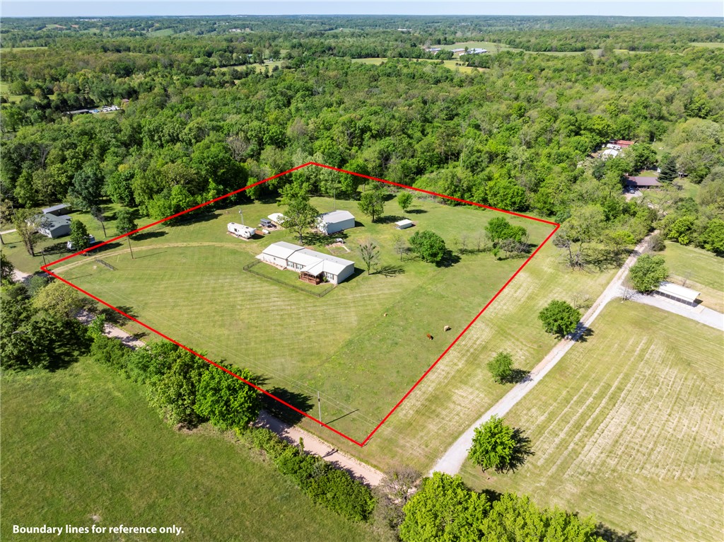 Discover modern living at 17011 Ross RD, Sulphur Springs, Arkansas. Built in 2020, this manufactured home offers 1950 square feet of thoughtfully designed space, presenting a contemporary foundation for your next chapter. The residence provides three comfortable bedrooms, offering versatile spaces for rest and personalization. Complementing these are two well-appointed bathrooms, designed for daily convenience and ease. This property offers a fresh start in a modern home. We invite you to explore the possibilities this residence presents. Also with a 30 x 40 insulated shop,cattle shed, RV hookup with carport and propane generator and storm shelter.