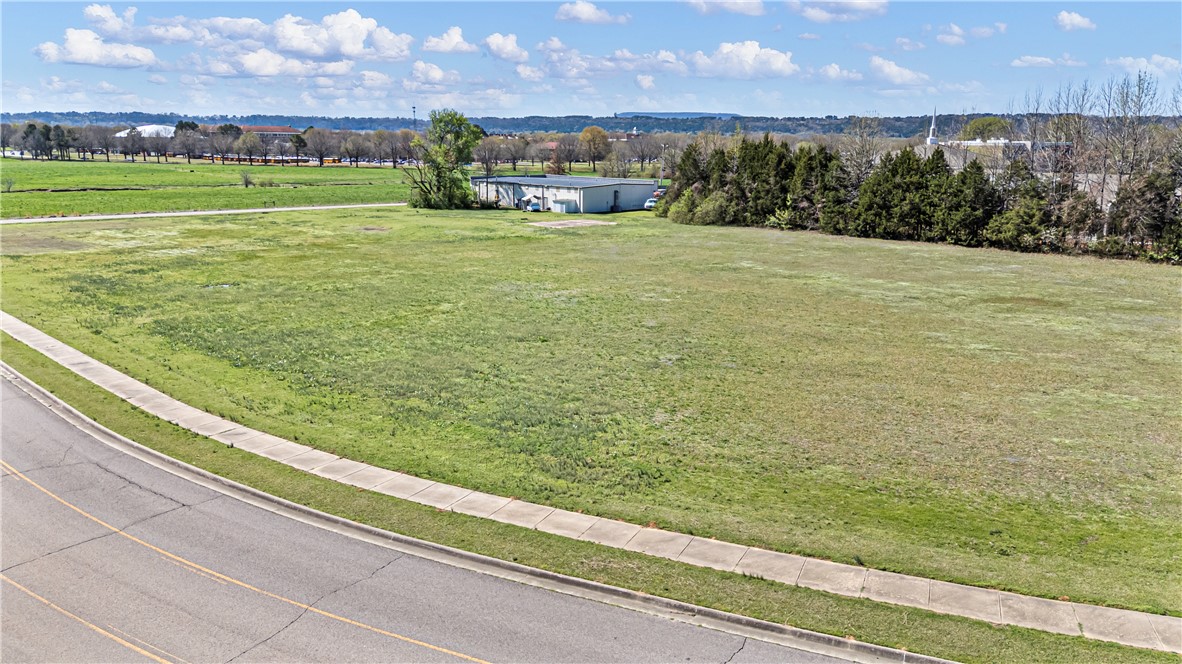 Prime Commercial Opportunity with Interstate Exposure! Position your business for success with this exceptional commercial tract located directly adjacent to Interstate 40, offering outstanding visibility and easy accessibility. With high daily traffic counts and direct interstate exposure, this property provides the perfect setting for a wide range of commercial ventures including but not limited to retail, hospitality, restaurants, travel services, or investment development. All utilities are conveniently located at the street, making this property development-ready and minimizing upfront infrastructure costs. The highly visible location ensures maximum exposure for signage and branding to thousands of travelers passing by each day. Whether you're looking to build, invest, or expand your business footprint, this is a rare opportunity to secure prime commercial land along one of the regions most traveled corridors.