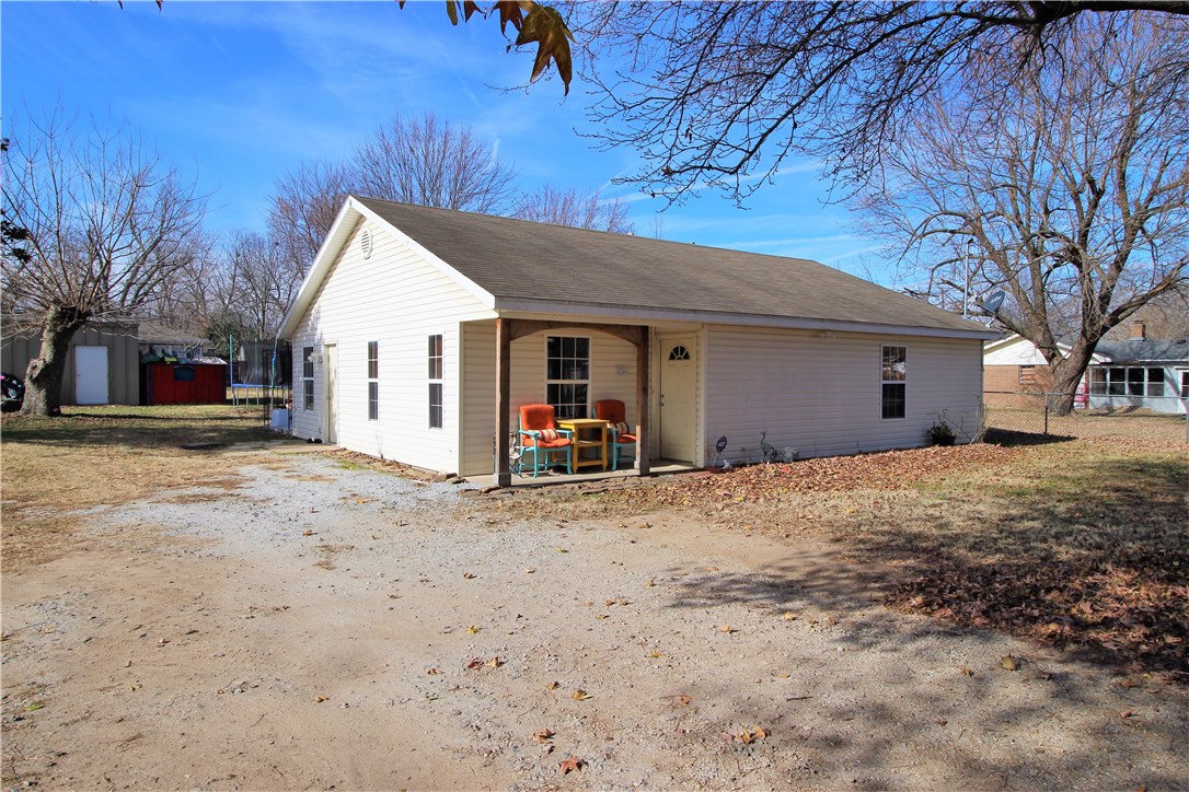 If you're looking for space in Springdale stop looking, this property is for you. A couple of blocks from downtown Springdale & Jone Center, in front of Harvey Jones Elementary, this property has a lot of 0.60 of an acre with 3 bedrooms 2 full baths wood like tile floors, granite counter tops in kitchen and bathrooms and a shop. This property is divided into 3 lots and can be developed.  You can build 1 home and a duplex at the vacant lots.  Great investment opportunity.