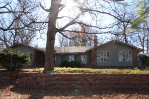 Come and fall in love with this beautiful piece of country paradise that is still close to town! This home features 4 bedrooms, 2.5 bathrooms with a beautiful, updated master suite, ample storage space, 2 brick wood fireplaces, wet bar in the living room, 4 car garage, partial basement and that is just a little of the interior! Enjoy a cup of coffee on the front porch while overlooking the pond that is stocked with fish and watching wildlife! Or go sit next to the koi pond that has a water feature! The land  has 2 stocked ponds, wildlife with a food plot, and mainly pasture!  This home has it all and more! There are many updates in this home including master bath remodel, kitchen counters and backsplash, and fresh paint and flooring! Don't let this one slip by!