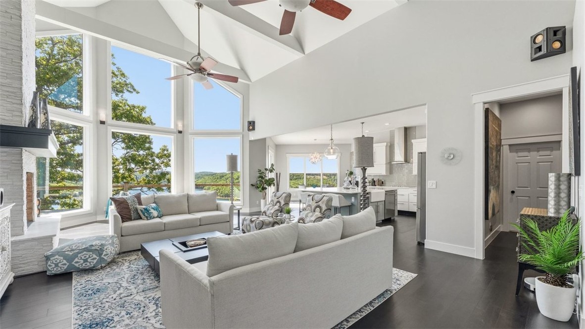 $6,000 IN PREFERRED LENDER CREDIT! Just in time for the heat of summer!  Walk right in & unpack your bags & enjoy the 180 degree view of Beaver Lake w/floor to ceiling windows along the back of the house.  The choice is yours, to step out on the brand new trek deck and enjoy the view or take the 5 min drive to the community boat slip and hop in your new 2012 Cobalt 232 and go out on the lake.  This completely remodeled, 3 bdrm, 2.5 bath home plus bonus comes completely furnished w/everything you need to enjoy all things lake, right down to the slip, boat and lift plus 2 car garage attached and an additional garage underneath for a side-by-side and all lake toys.  This home is one you don't want to miss!